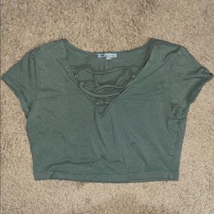 Olive green crop top with shoe lace design. Can be worn loose or tight!